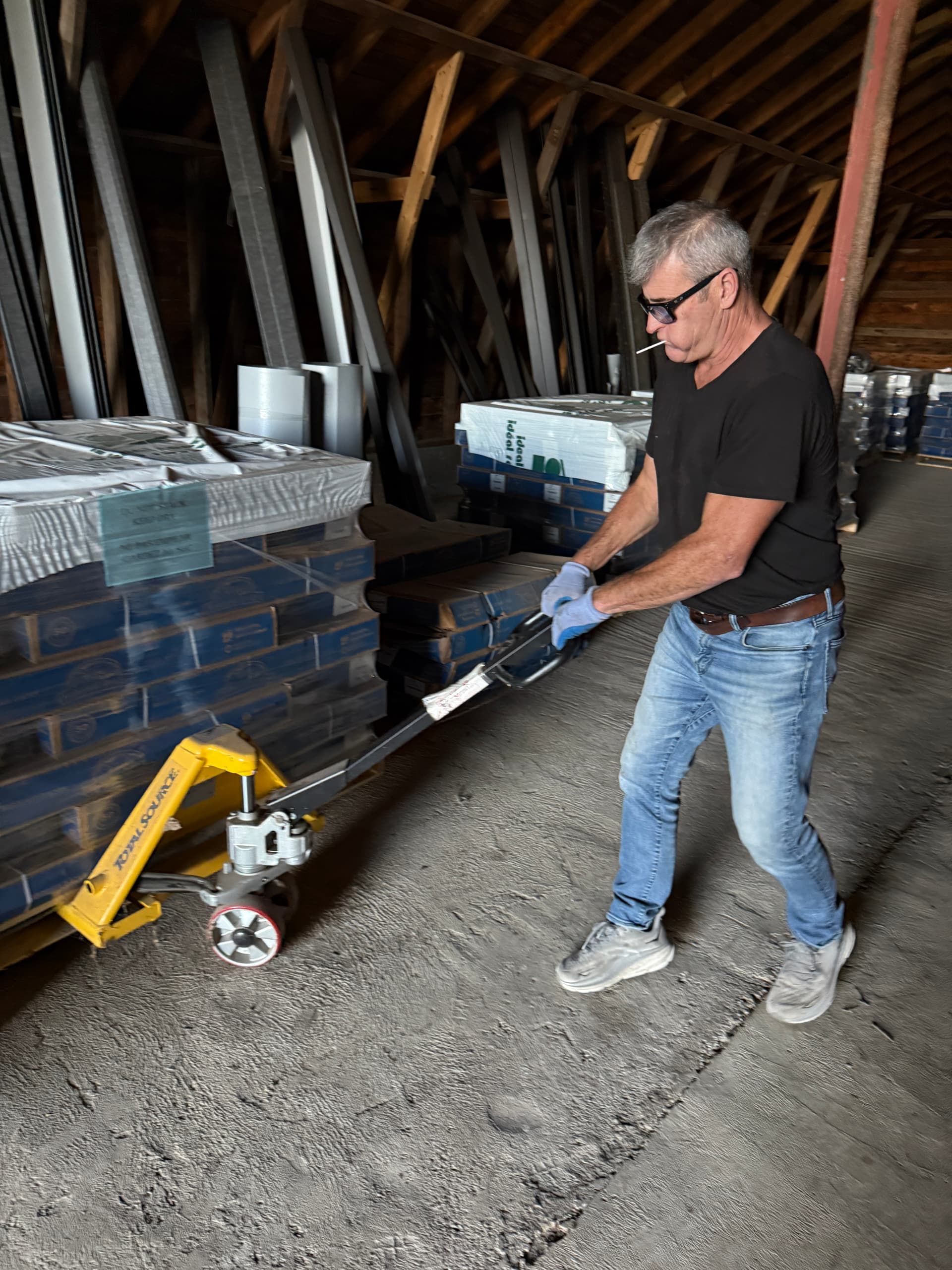 Ideal Roofing warehouse with stacked panels