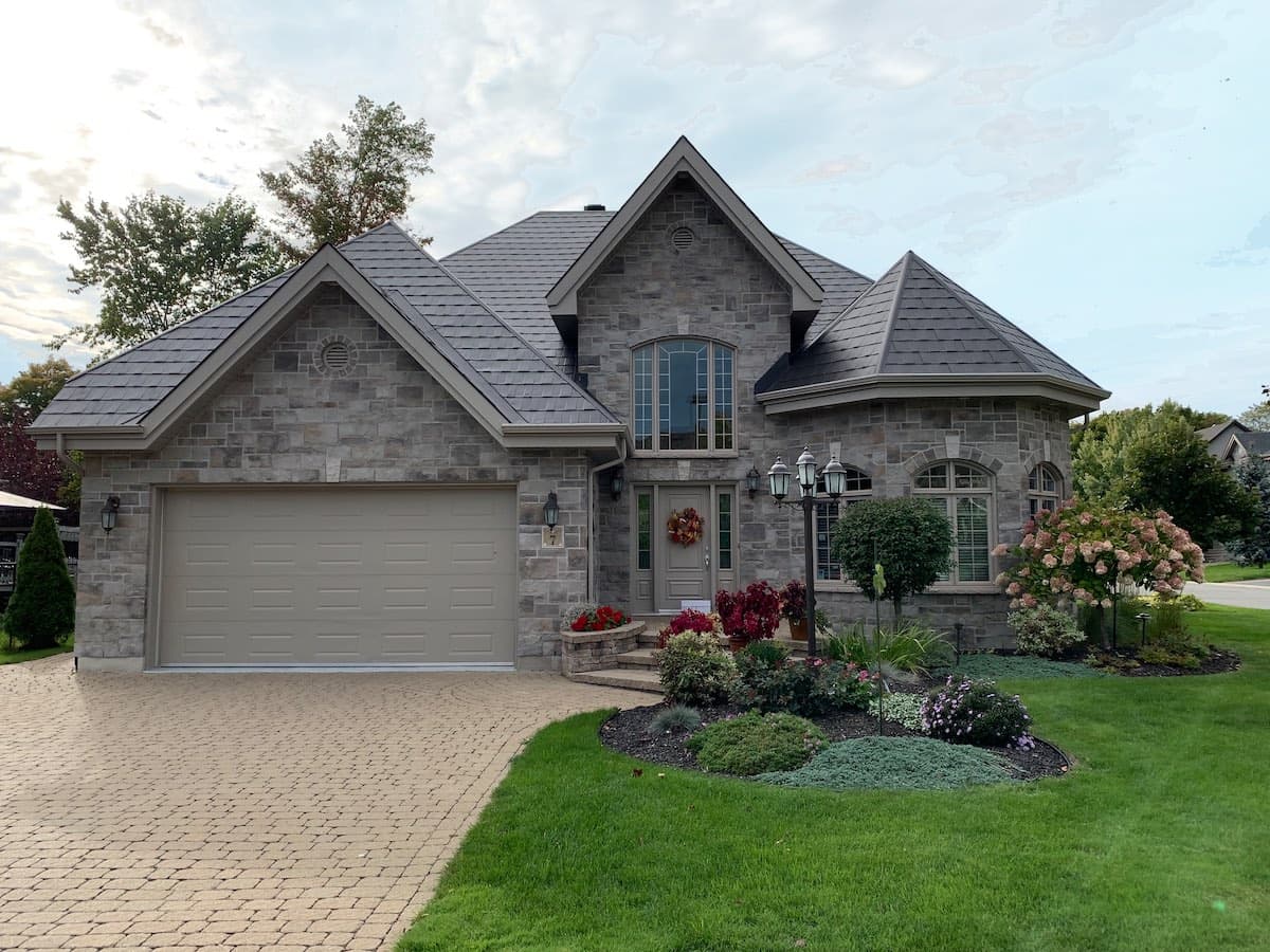 Wakefield Bridge in Espresso on a stone-clad luxury home