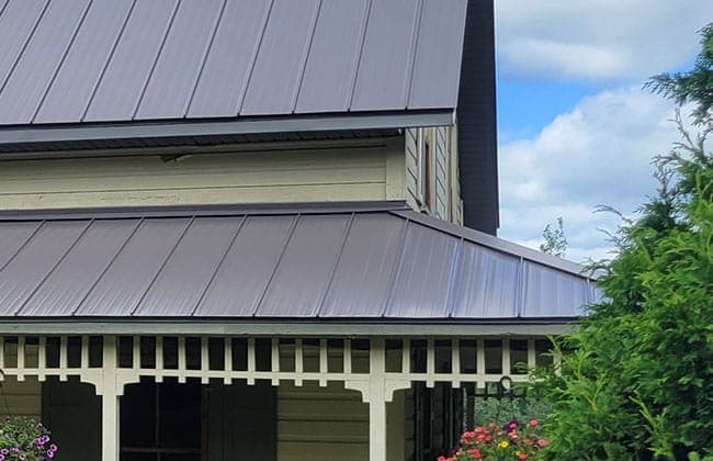 Junior H-F standing seam metal roof on a traditional country home