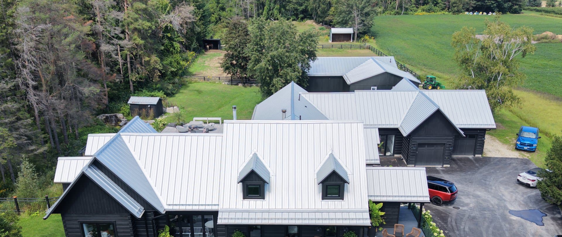 Aerial view of a Heritage Series standing seam roof in Stayner, Clearview Township, with matching roofs on the outbuildings