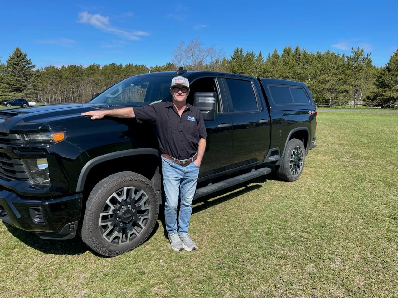 Colum Smyth, owner of Select Metal Roofing, beside his work truck in Creemore, Ontario — fifteen years of residential metal roofing across Simcoe County.